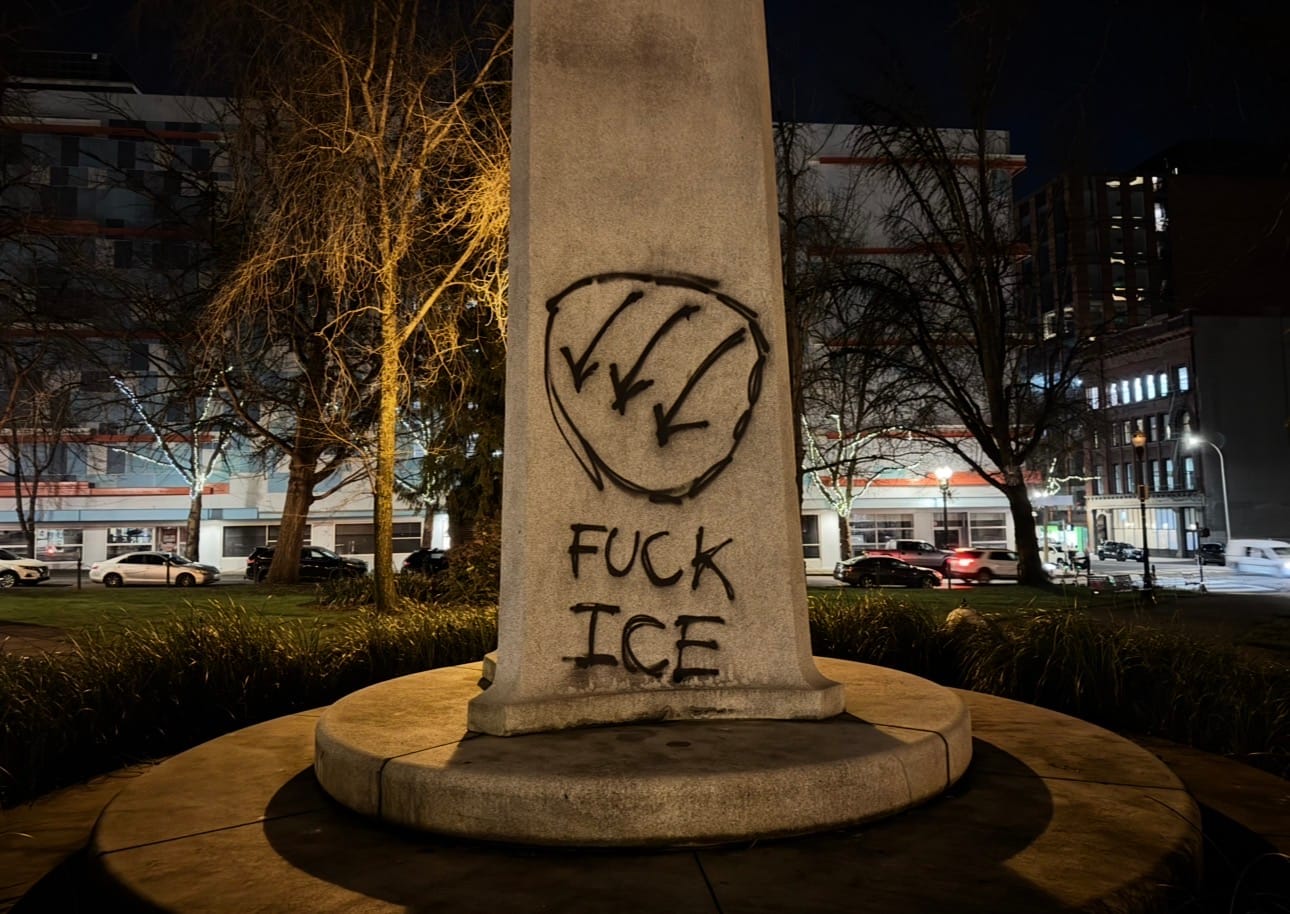 tagged statue says “fuck ICE” with an iron front